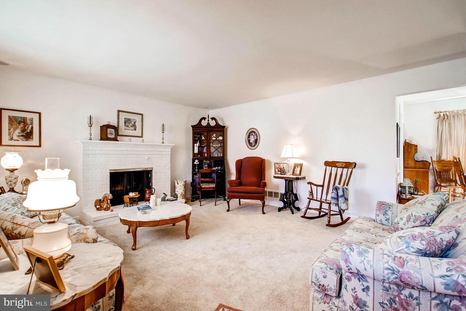 407 Homewood Road Linthicum, MD 21090 - Photo 3 of 23 a living room with furniture and a fireplace