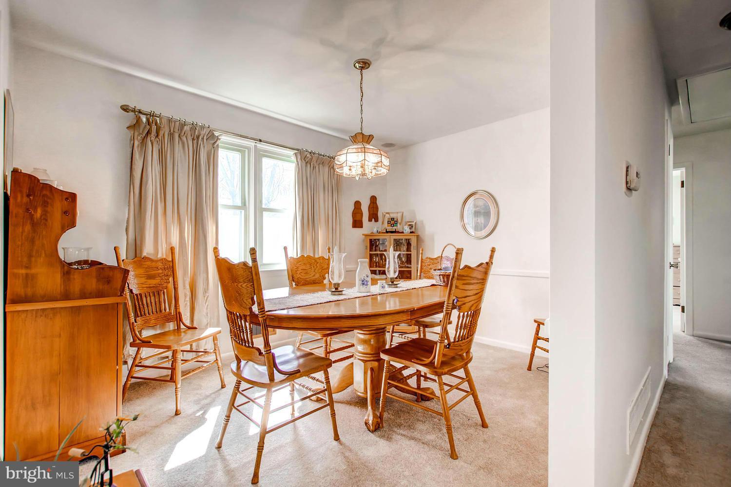 407 Homewood Road Linthicum, MD 21090 - Photo 5 of 23 a view of a dining room with furniture window and outside view