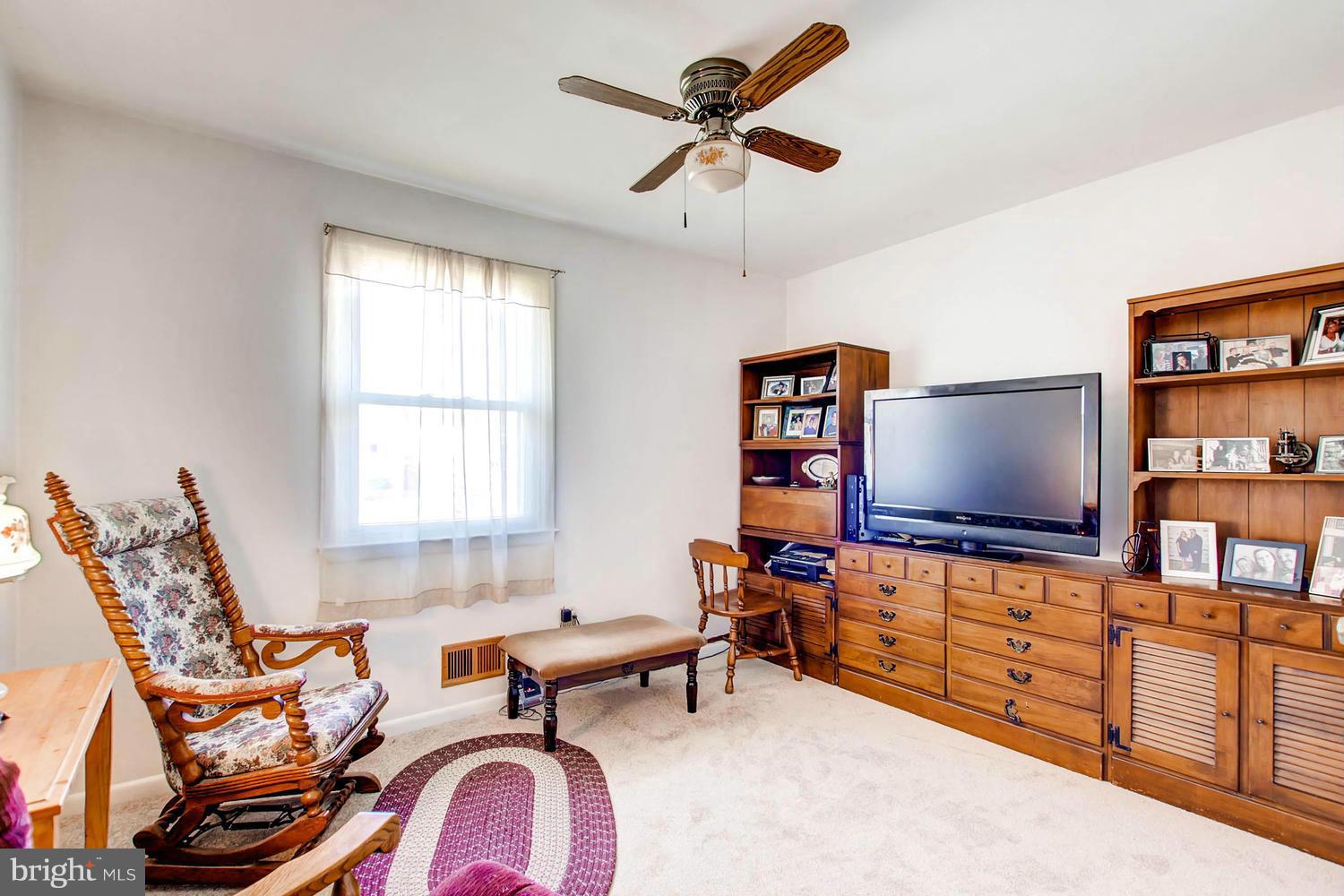 407 Homewood Road Linthicum, MD 21090 - Photo 9 of 23 a living room with furniture a window and a flat screen tv