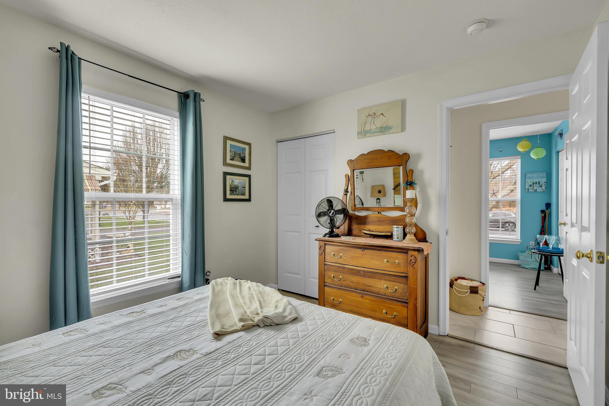 33525 Westhampton Lane Ocean View, DE 19970 - Photo 15 of 49 a bedroom with a bed and wooden floor