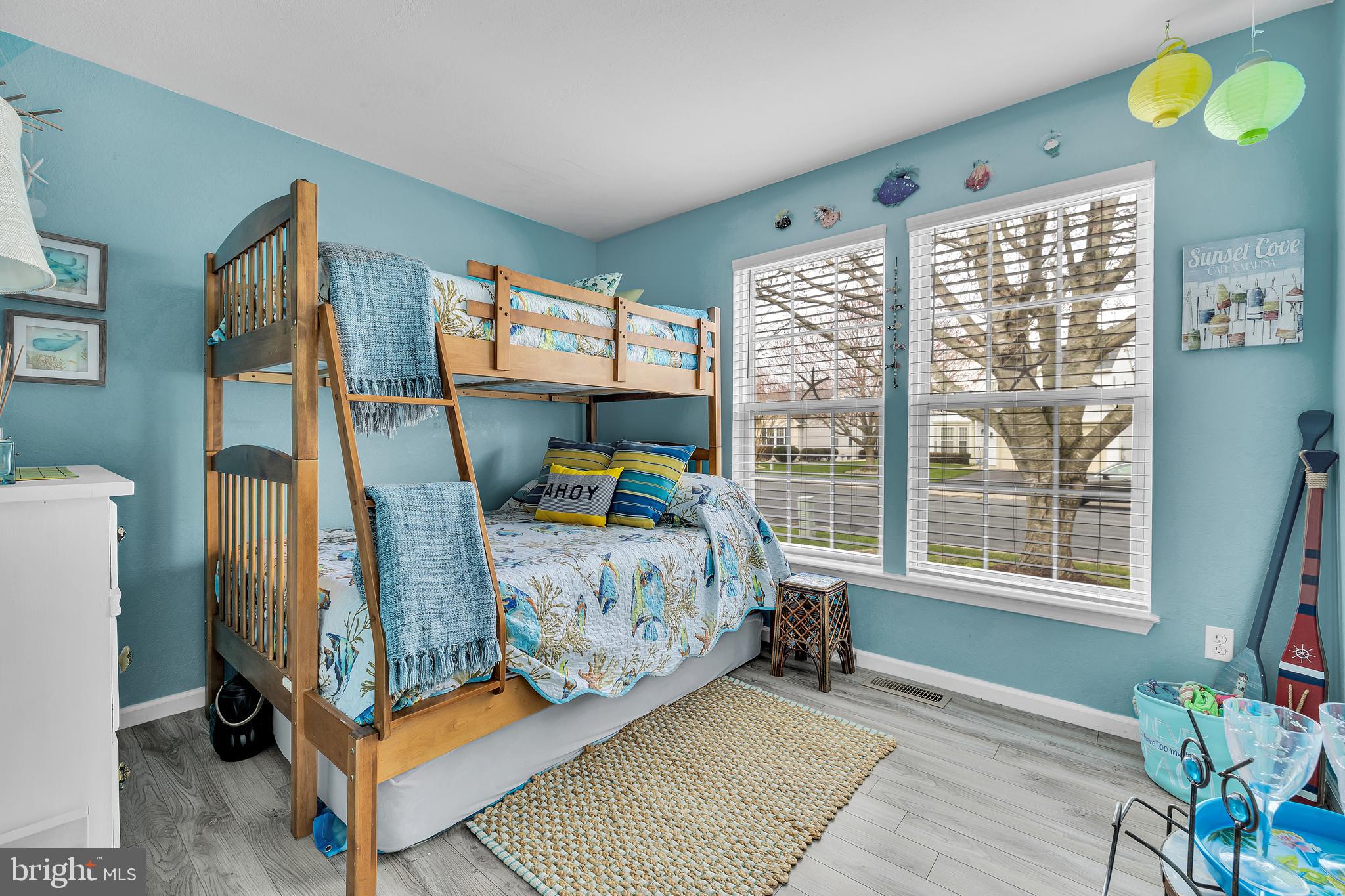 33525 Westhampton Lane Ocean View, DE 19970 - Photo 17 of 49 a bedroom with a bed and window