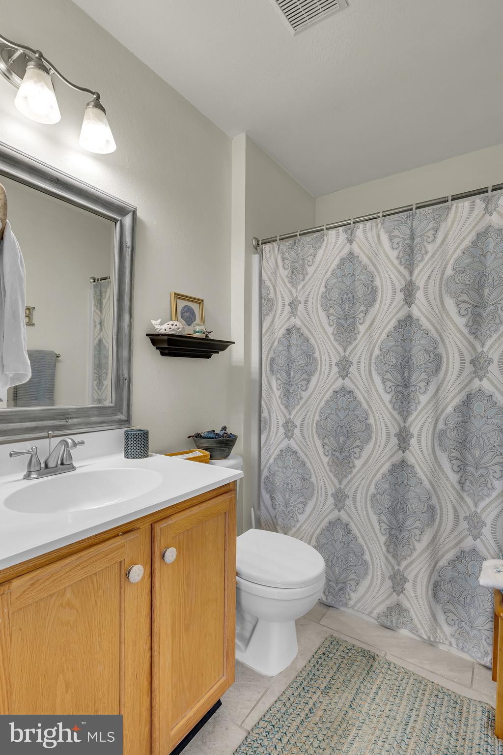 33525 Westhampton Lane Ocean View, DE 19970 - Photo 25 of 49 a bathroom with a sink toilet and shower