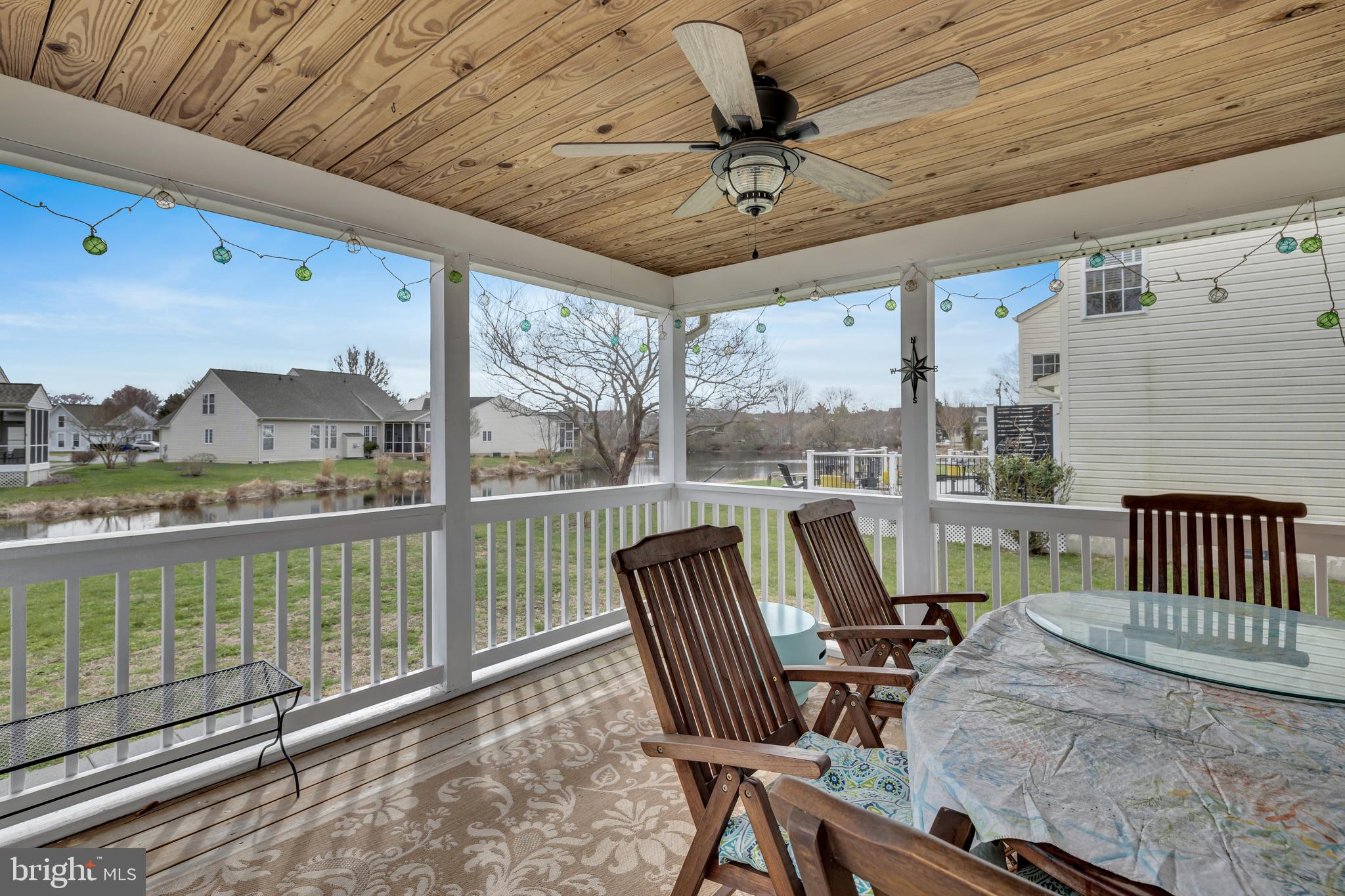 33525 Westhampton Lane Ocean View, DE 19970 - Photo 28 of 49 a view of a porch with furniture and a yard