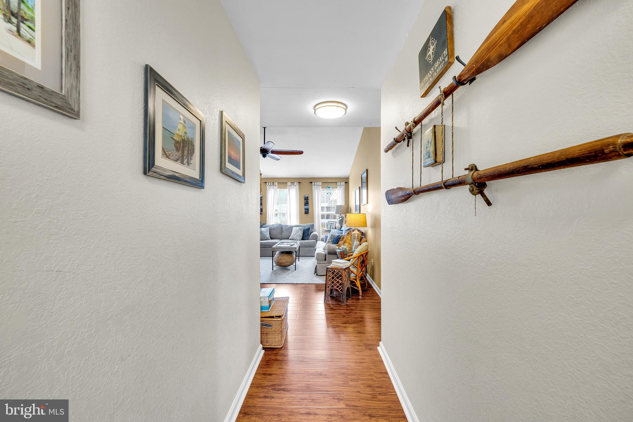 33525 Westhampton Lane Ocean View, DE 19970 - Photo 4 of 49 a view of a hallway with couch and windows