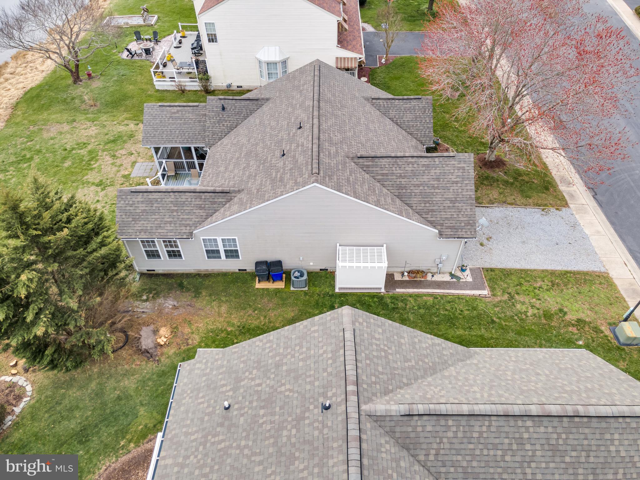 33525 Westhampton Lane Ocean View, DE 19970 - Photo 42 of 49 a aerial view of a house next to a yard and large trees