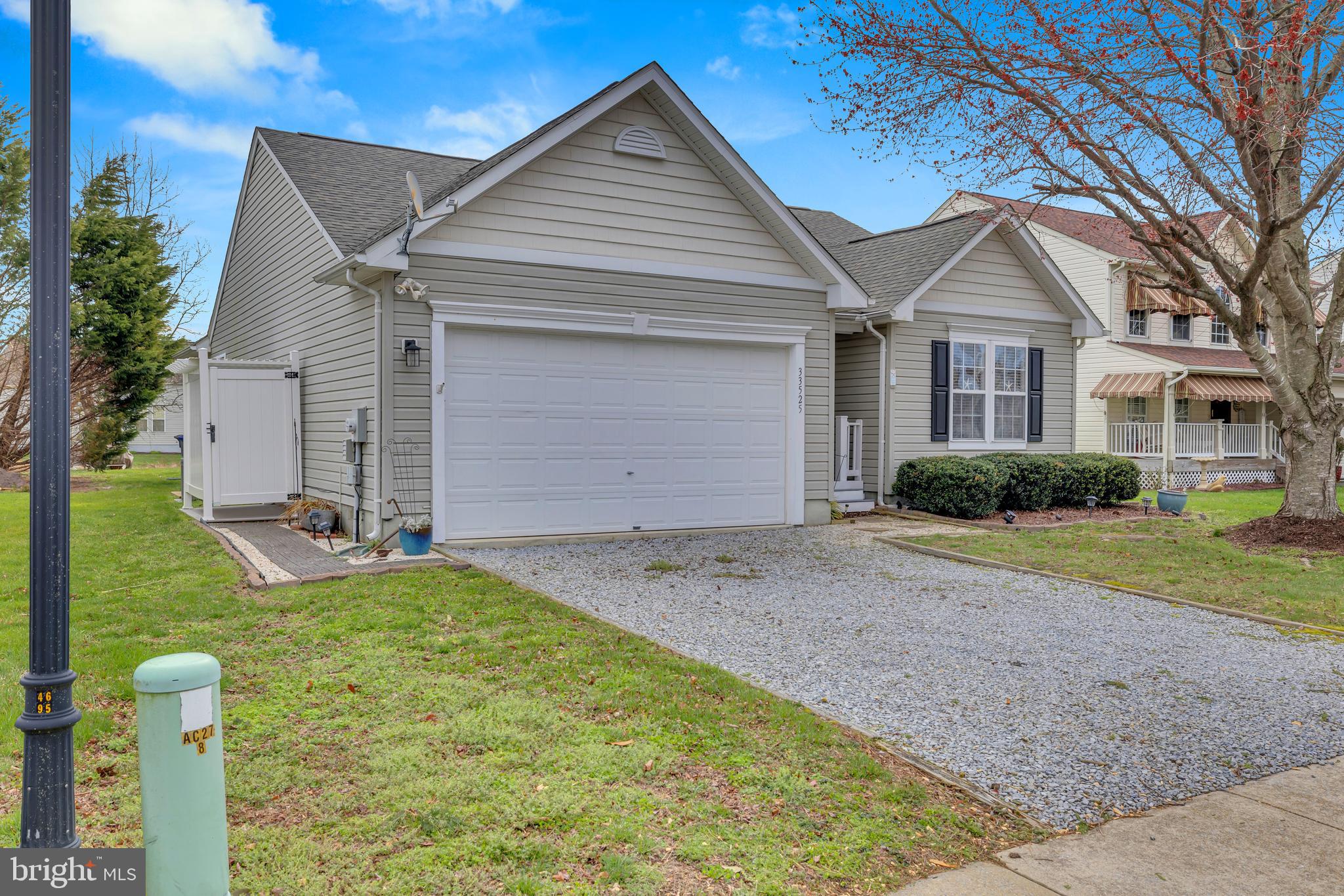 33525 Westhampton Lane Ocean View, DE 19970 - Photo 45 of 49 a front view of a house with a yard and garage