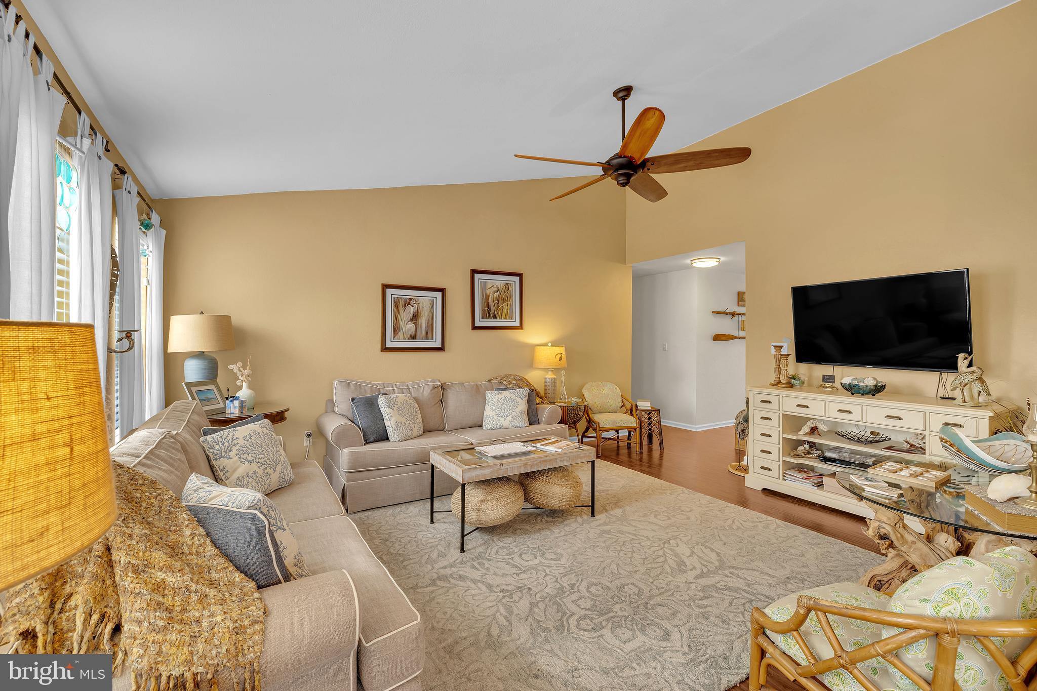 33525 Westhampton Lane Ocean View, DE 19970 - Photo 8 of 49 a living room with furniture and a flat screen tv