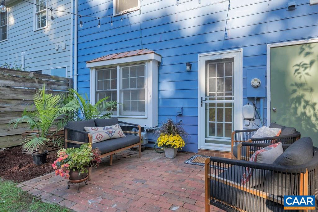 1436 Minor Ridge Court Charlottesville, VA 22901 - Photo 39 of 59 a view of a house with a chairs and table in a patio