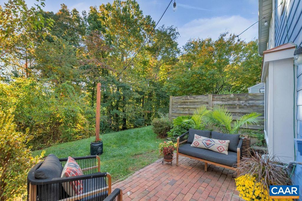 1436 Minor Ridge Court Charlottesville, VA 22901 - Photo 40 of 59 a view of backyard with seating space and trees in the background