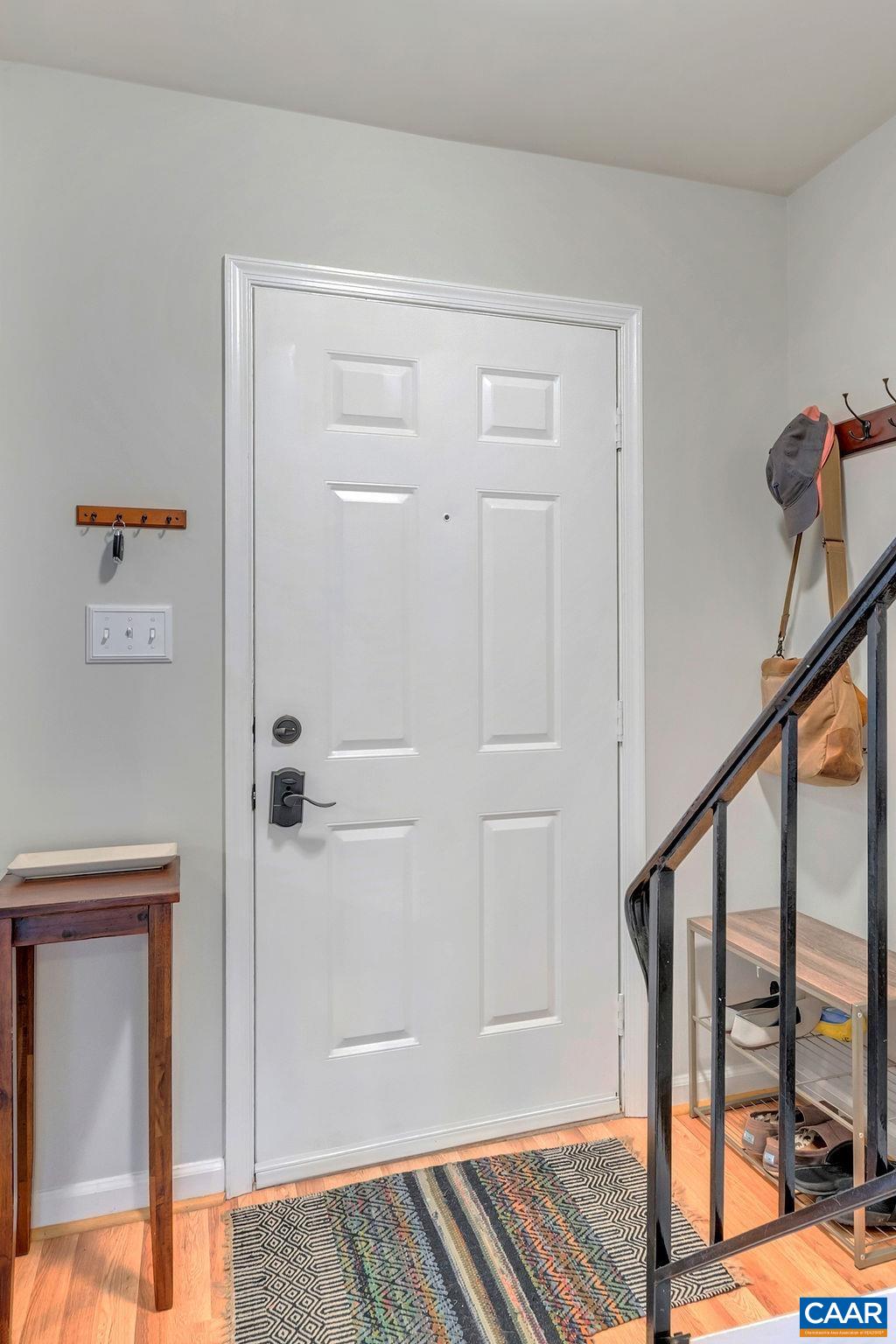 1436 Minor Ridge Court Charlottesville, VA 22901 - Photo 4 of 59 a view of a hallway with wooden floor and staircase
