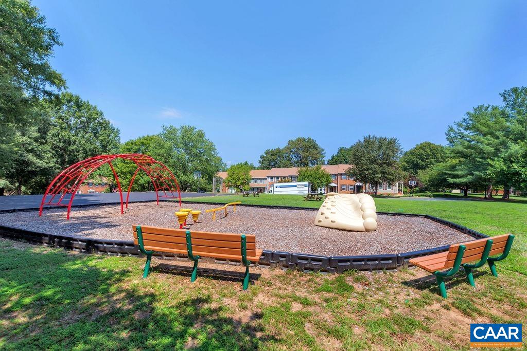 1436 Minor Ridge Court Charlottesville, VA 22901 - Photo 50 of 59 a wooden bench sitting in the middle of a park