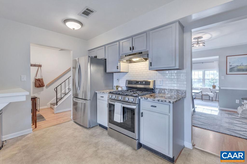 1436 Minor Ridge Court Charlottesville, VA 22901 - Photo 8 of 59 a kitchen with stainless steel appliances granite countertop a stove a refrigerator and a sink