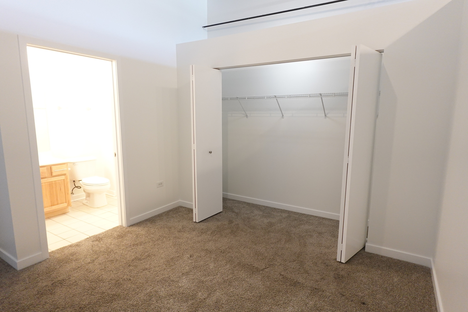 3963 West Belmont Avenue, Unit 219 Chicago, IL 60618 - Photo 13 of 28 a view of an empty room