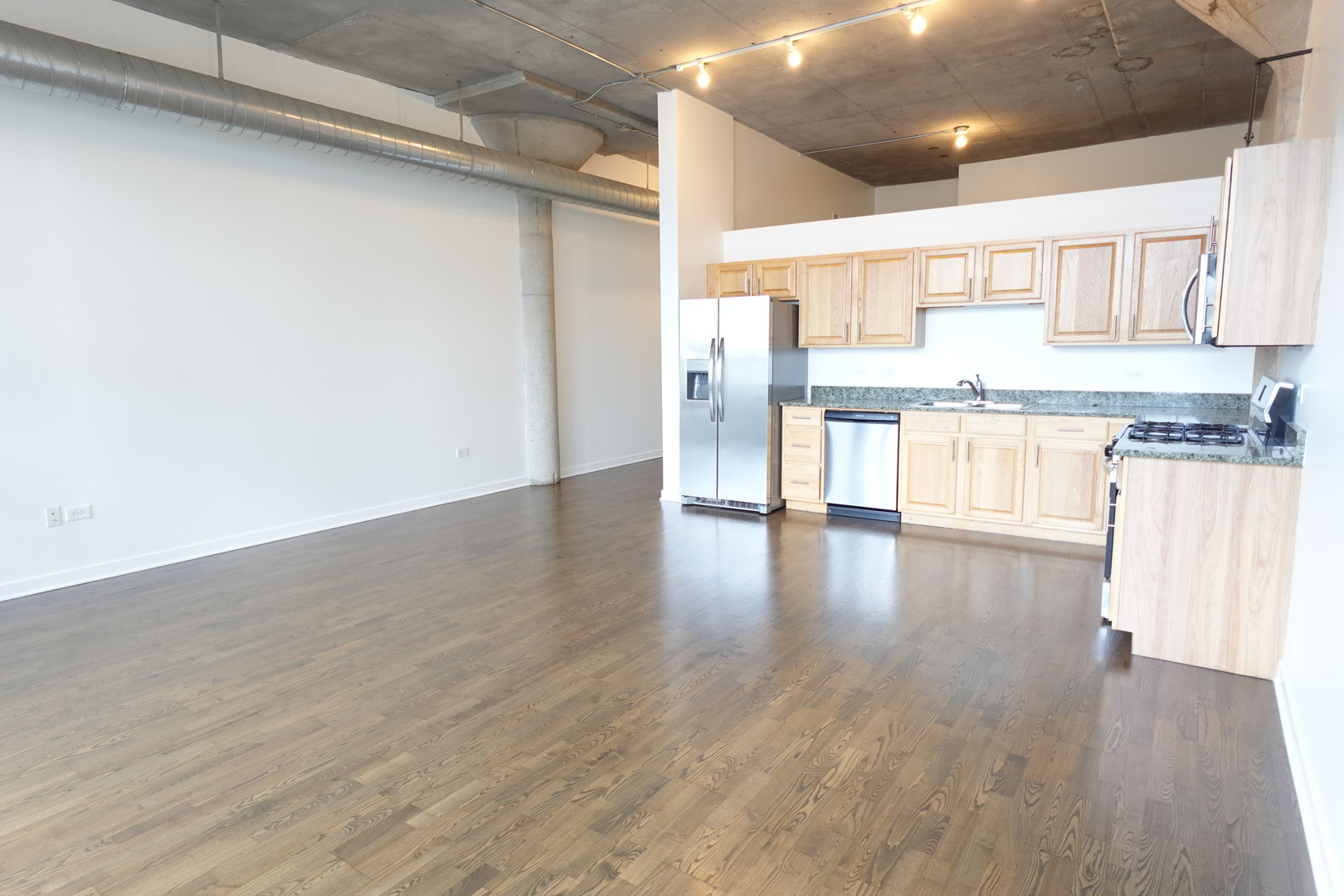 3963 West Belmont Avenue, Unit 219 Chicago, IL 60618 - Photo 8 of 28 a view of a kitchen with wooden floor
