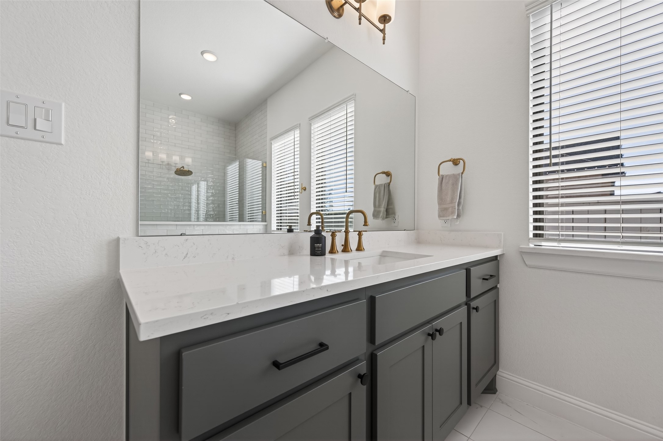 175 Shoveler Duck Way Magnolia, TX 77354 - Photo 27 of 48 a bathroom with a sink double vanity and a mirror