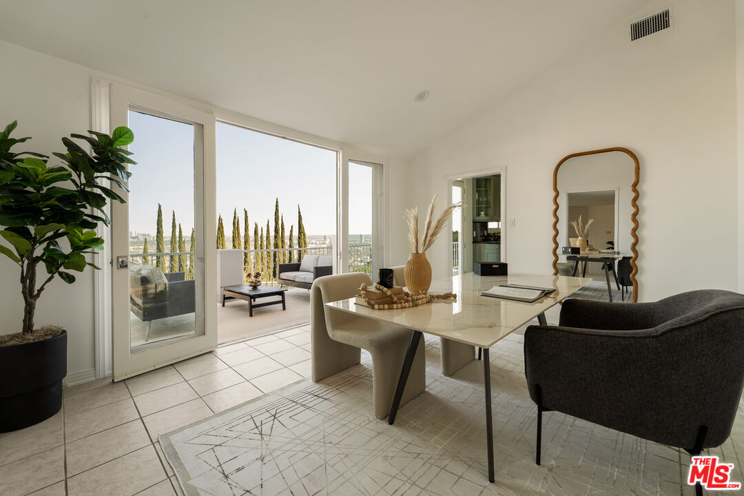 8527 Hedges Way Los Angeles, CA 90069 - Photo 16 of 25 a living room with furniture a large window and a potted plant