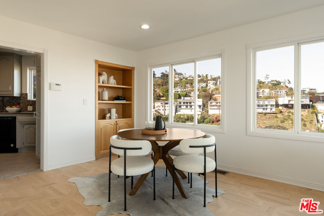 8527 Hedges Way Los Angeles, CA 90069 - Photo 20 of 25 a dining room with furniture and window