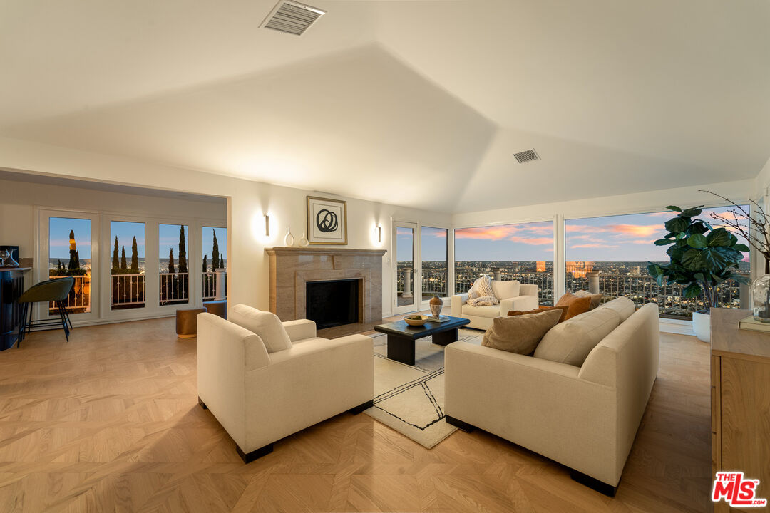 8527 Hedges Way Los Angeles, CA 90069 - Photo 22 of 25 a living room with furniture and a fireplace