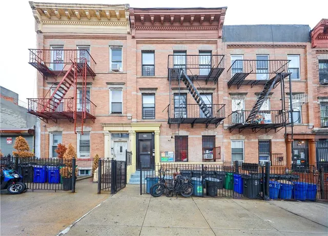 a front view of a building with retail shops