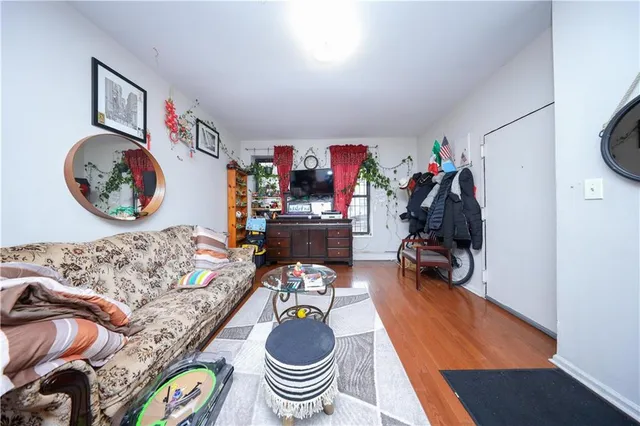 a room with furniture and a view of bedroom