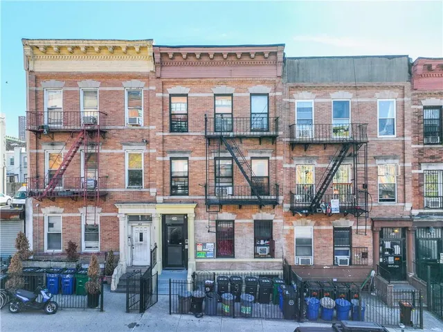 a city street filled with lots of tall buildings