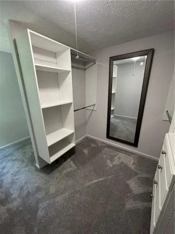 a view of an empty room with a fireplace