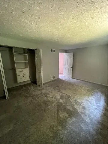 an empty room with a fireplace