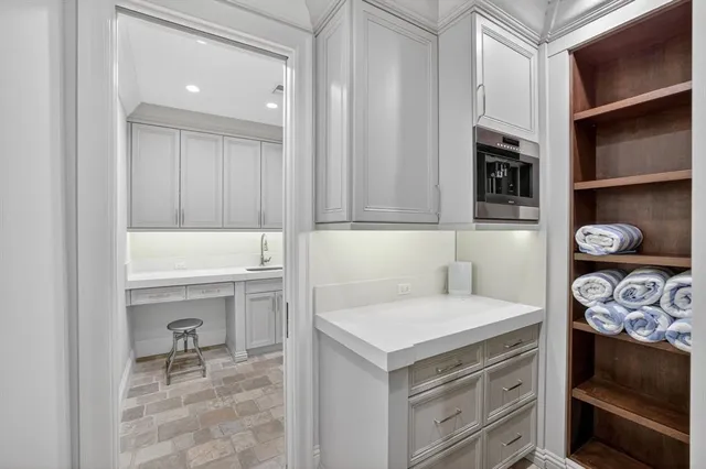 a view of a lake with boats and palm trees