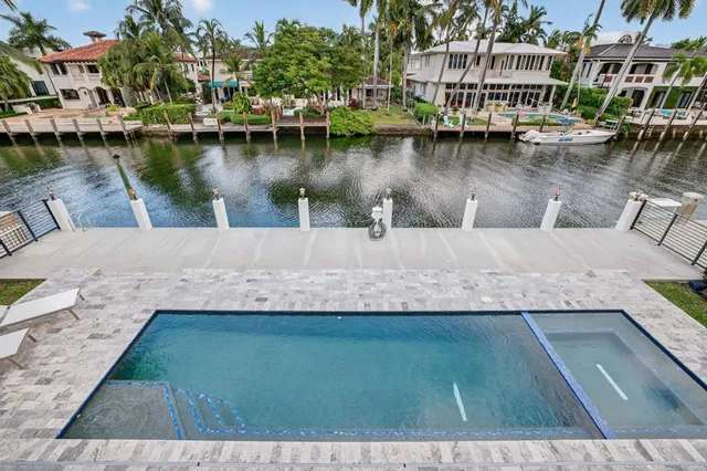an aerial view of multiple houses with outdoor space