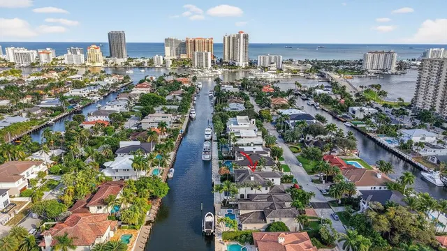 a living room with furniture and large windows