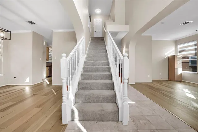 a view of entryway and hall with wooden floor