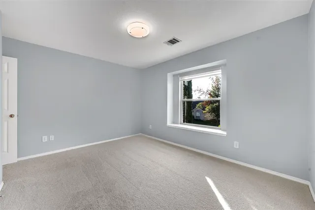 a view of an empty room with window