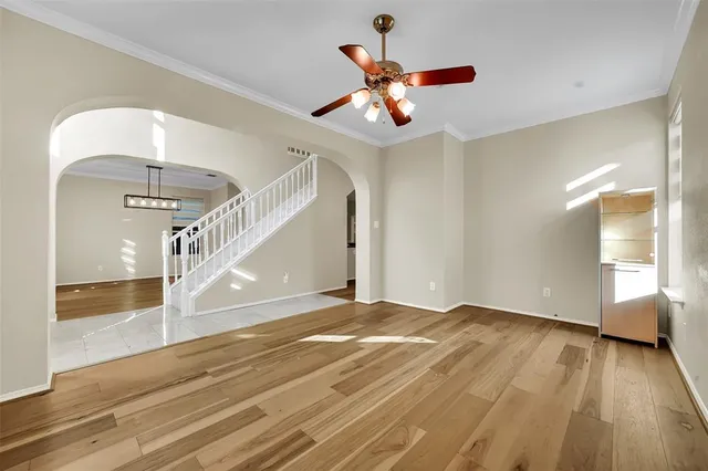 a view of an empty room and wooden floor