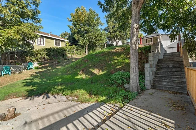a backyard of a house with lots of green space