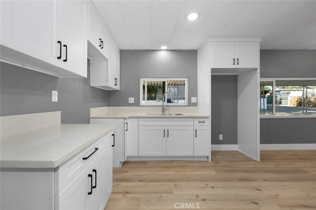 17221 Hidalgo Drive Perris, CA 92570 - Photo 12 of 32 a spacious bathroom with a double vanity sink and mirror