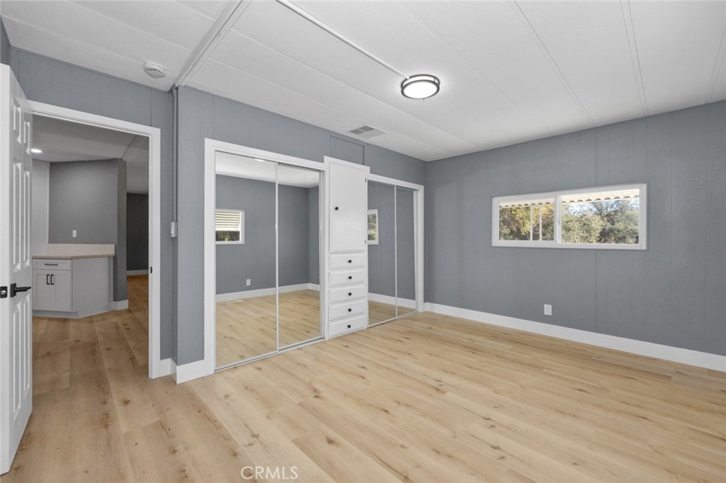 17221 Hidalgo Drive Perris, CA 92570 - Photo 15 of 32 wooden floor in an empty room with a window