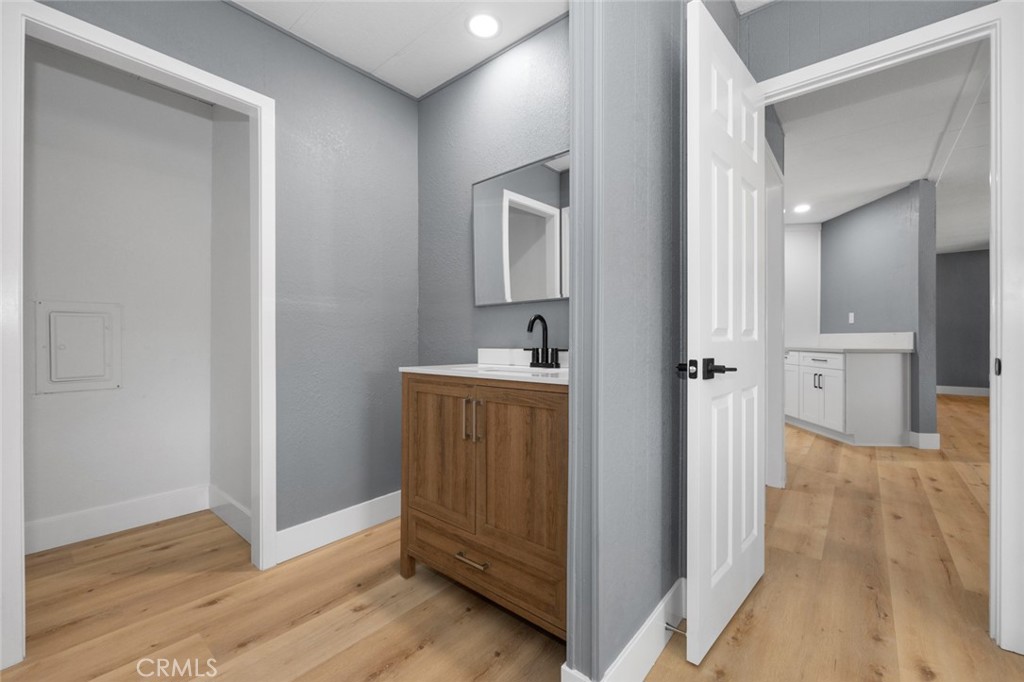 17221 Hidalgo Drive Perris, CA 92570 - Photo 17 of 32 a view of a hallway with closet and wooden floor