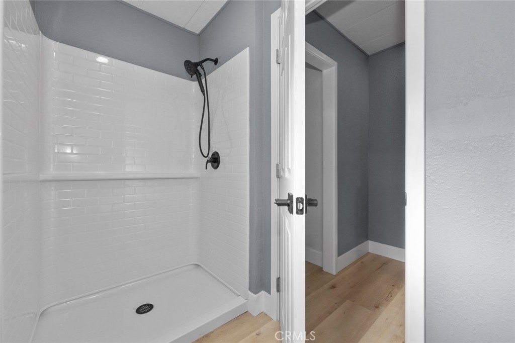 17221 Hidalgo Drive Perris, CA 92570 - Photo 18 of 32 a bathroom with a glass shower door