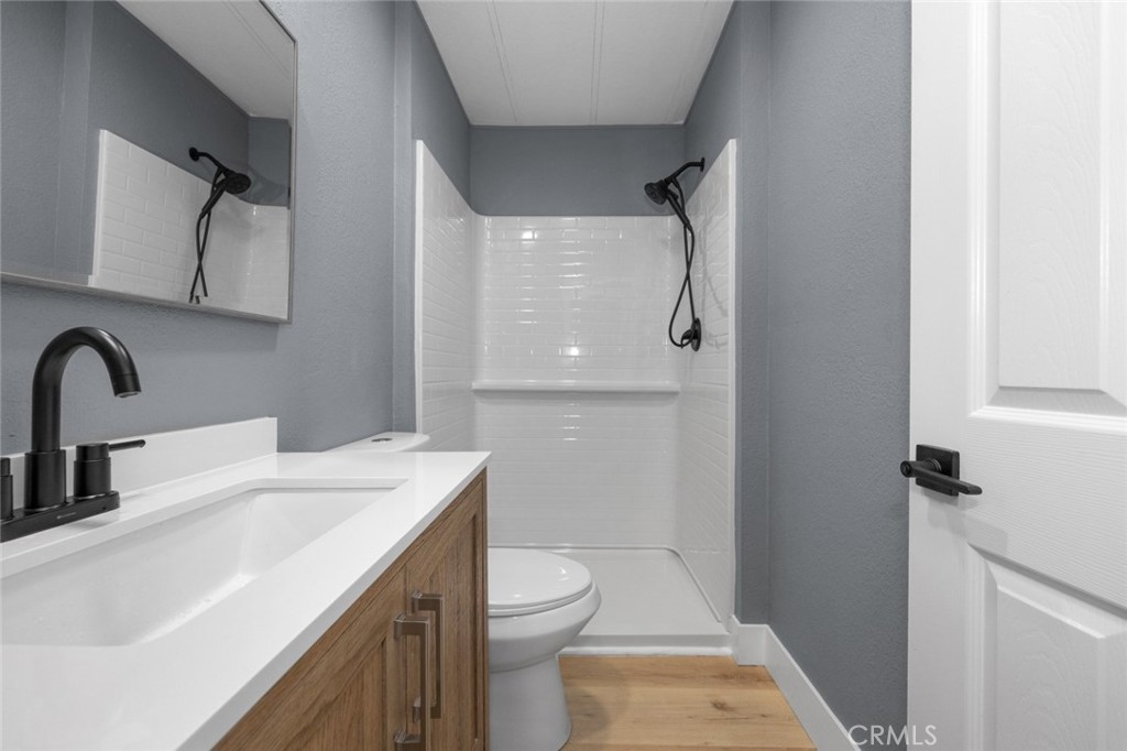 17221 Hidalgo Drive Perris, CA 92570 - Photo 23 of 32 a bathroom with a sink toilet and shower