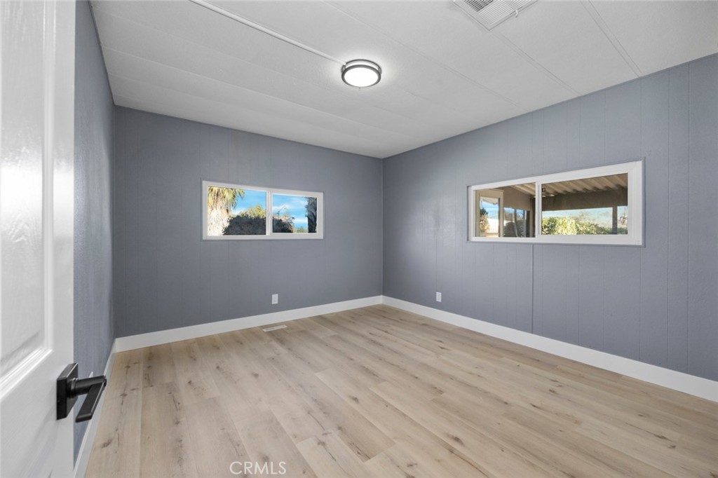 17221 Hidalgo Drive Perris, CA 92570 - Photo 24 of 32 a view of empty room with wooden floor and fan