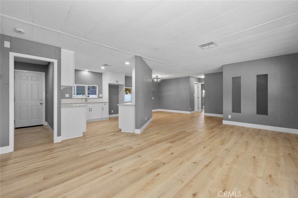 17221 Hidalgo Drive Perris, CA 92570 - Photo 4 of 32 a view of a kitchen with a sink and a refrigerator
