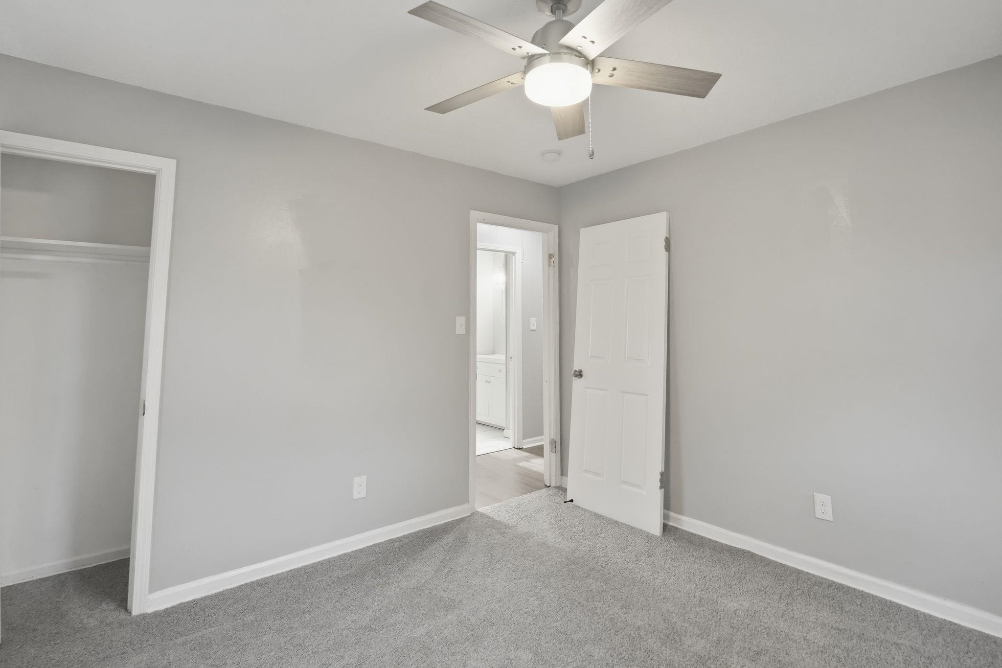 4686 Gill Road Memphis, TN 38109 - Photo 25 of 32 Room featuring light gray walls, gray carpet flooring, and white trim