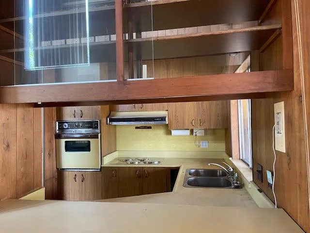 a kitchen with stainless steel appliances granite countertop a stove and a cabinets