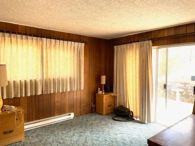 a view of a room with a large window