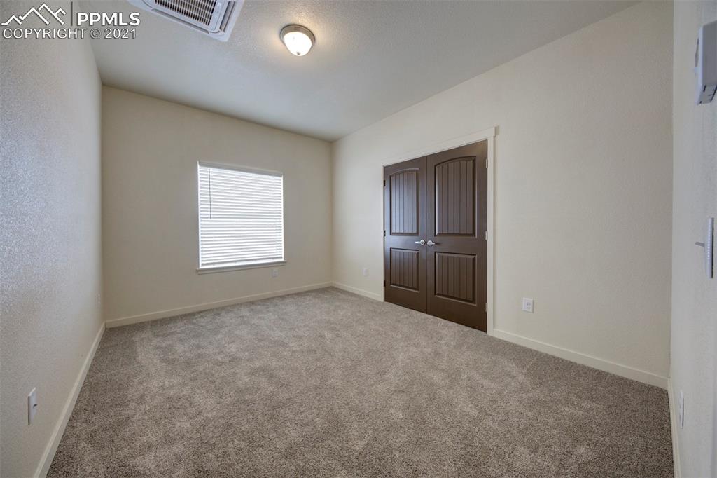 1075 Yoder Road Yoder, CO 80864 - Photo 11 of 14 an empty room with windows
