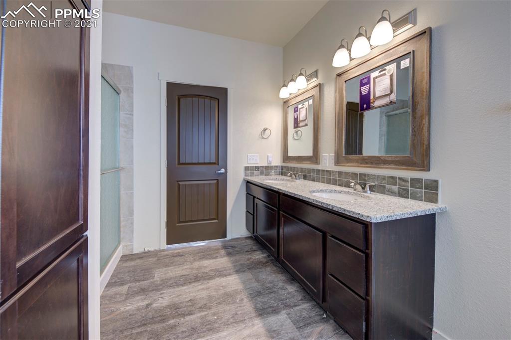 1075 Yoder Road Yoder, CO 80864 - Photo 8 of 14 a bathroom with a sink a vanity and a mirror