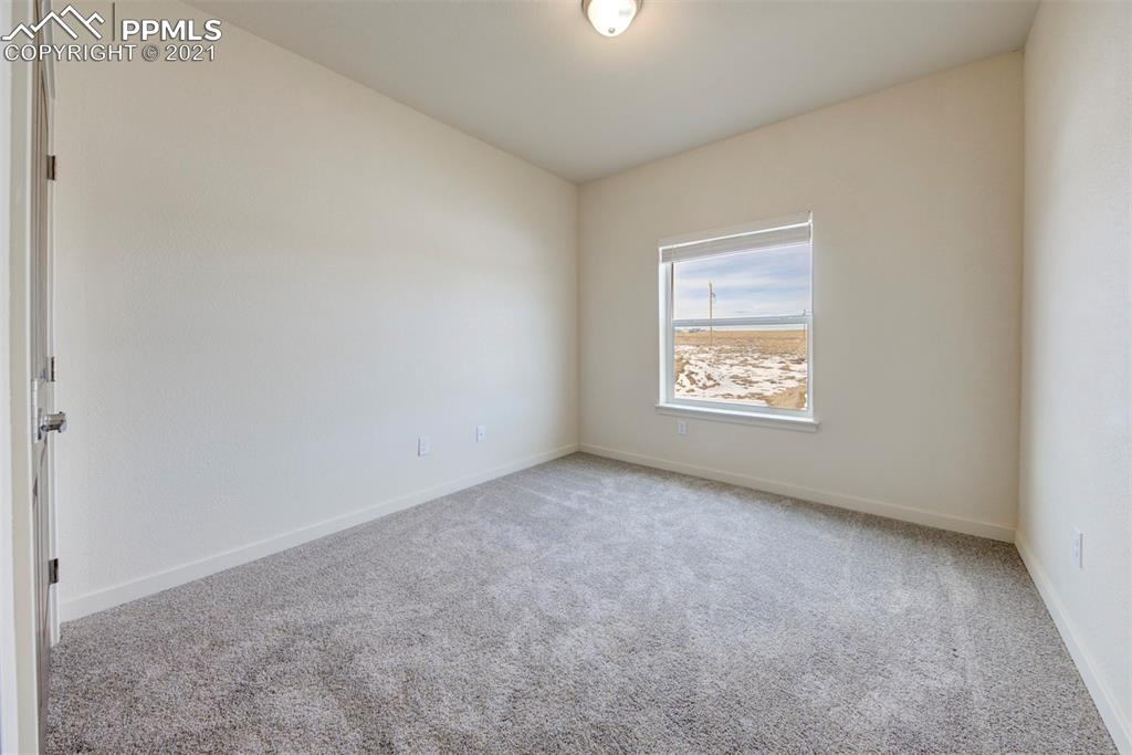 1075 Yoder Road Yoder, CO 80864 - Photo 10 of 14 an empty room with a window