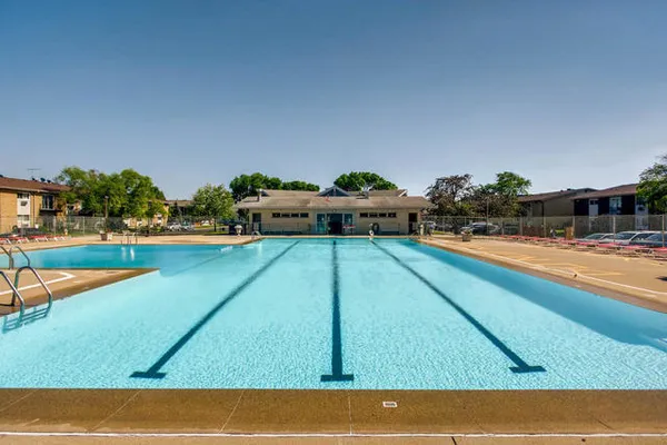 a view of a swimming pool with an outdoor seating