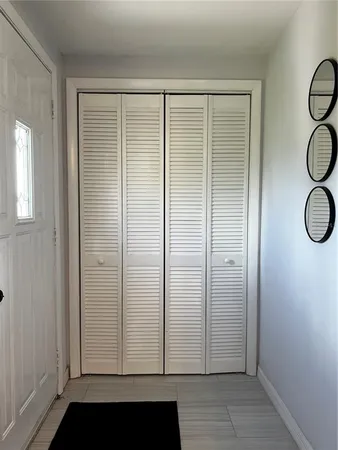 a bedroom with bed and a chandelier