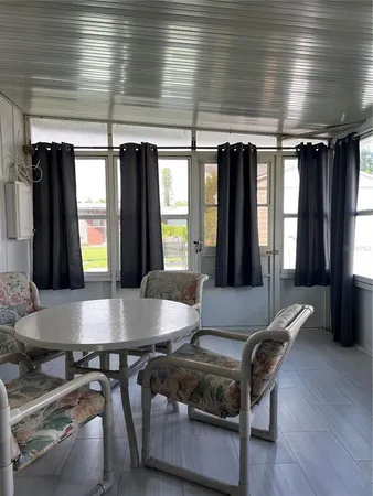 a view of a tables and chairs in patio